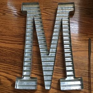Rustic metal M wall hanging